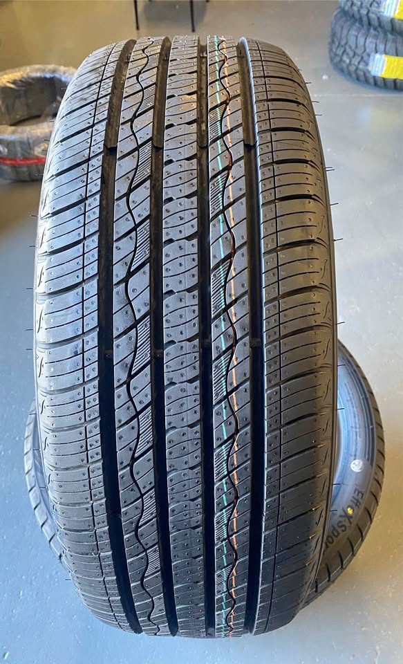 Car tire with tread pattern on a flat surface