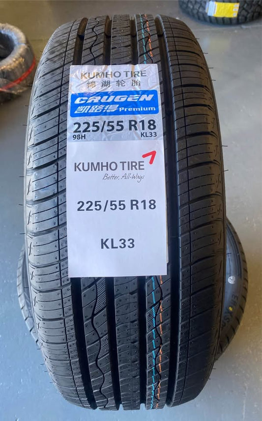 Kumho tire with specifications label on a gray surface