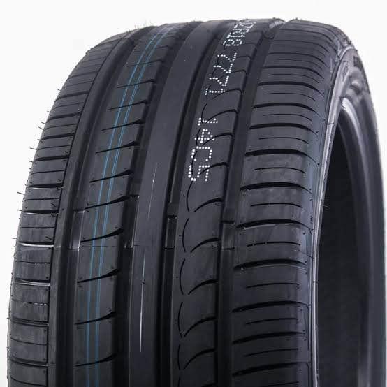 A black AUSTONE SP-701 tire with tread pattern designed for driving safety and noise control.