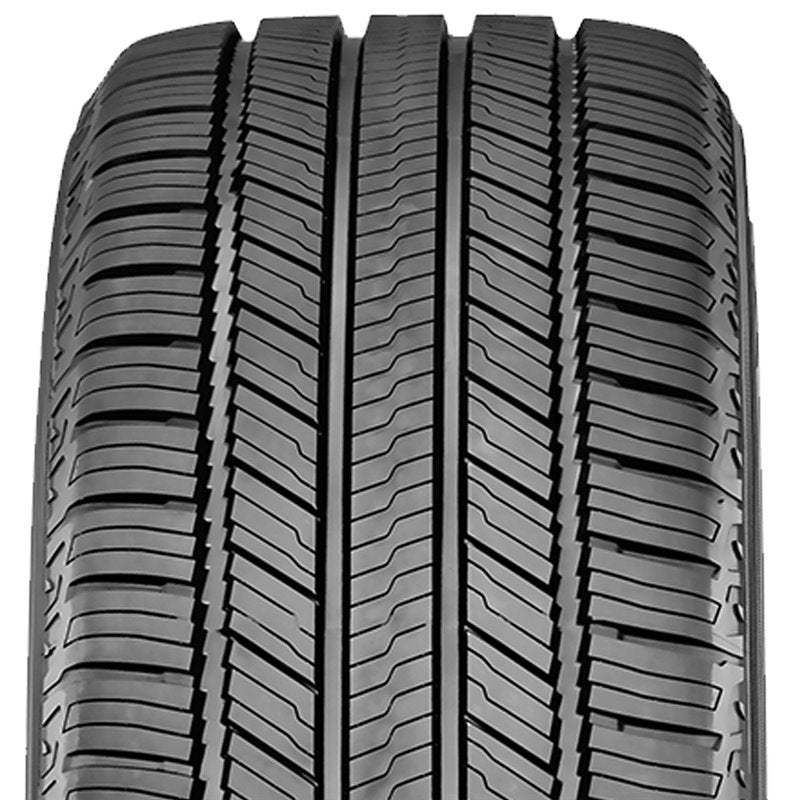 Close-up of a tire with tread pattern on a white background