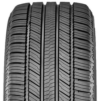 Close-up of a tire with tread pattern on a white background