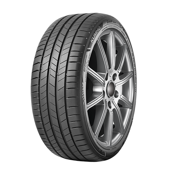 Car tire with a silver alloy wheel on a white background