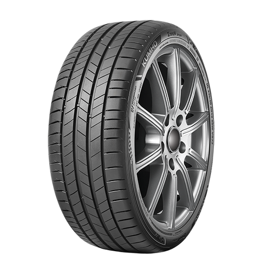 Car tire with a silver alloy wheel on a white background
