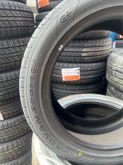 Stack of Yokohama V108 EV tires with visible branding and tread patterns