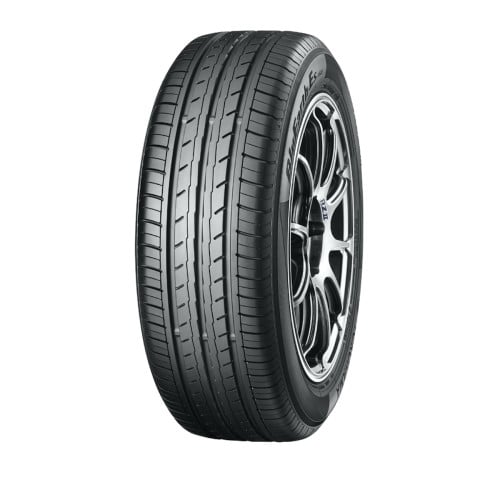 Car tire with a silver alloy wheel on a white background