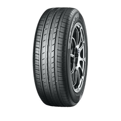 Car tire with a silver alloy wheel on a white background