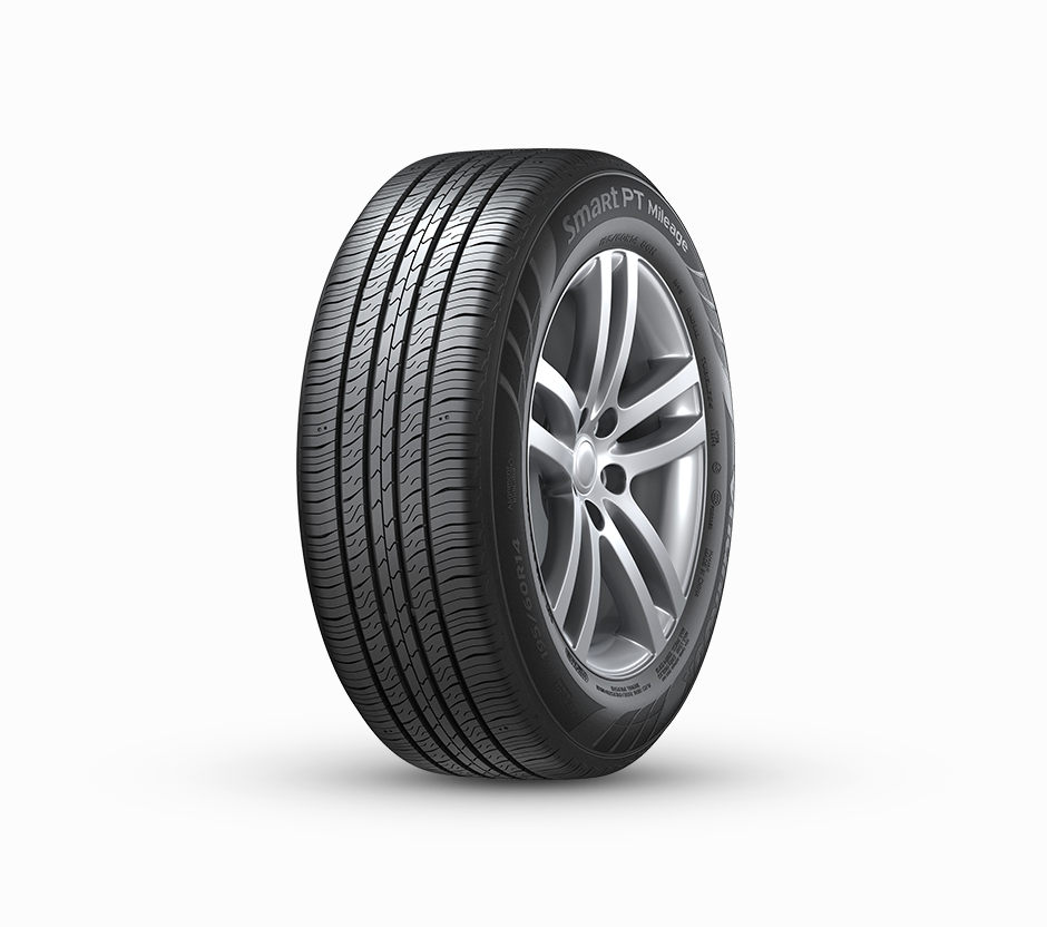 Car tire with alloy wheel on a white background