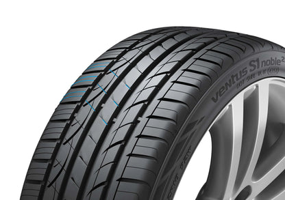 Car tire with visible branding on a white background