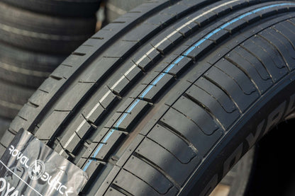 Close-up of a tire with visible tread pattern and brand logo.